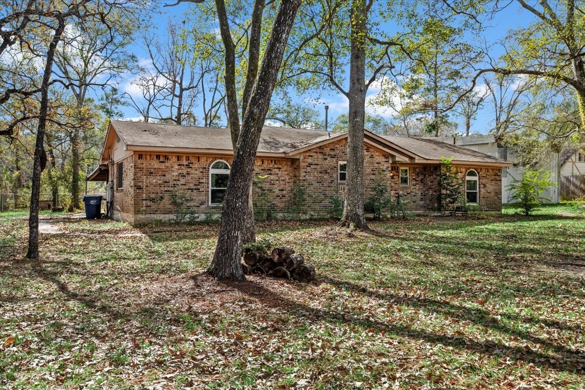 504 Catfish Lane Conroe, TX 77384 - Photo 1 of 48 a view of a house with a yard