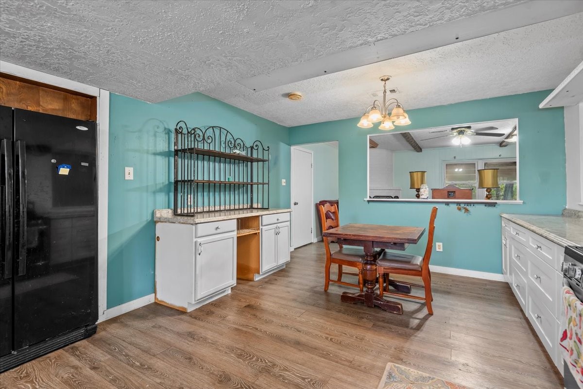 504 Catfish Lane Conroe, TX 77384 - Photo 15 of 48 a kitchen with granite countertop breakfast area