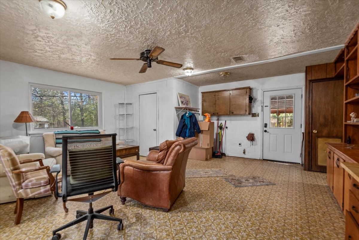 504 Catfish Lane Conroe, TX 77384 - Photo 25 of 48 a living room with furniture and a flat screen tv