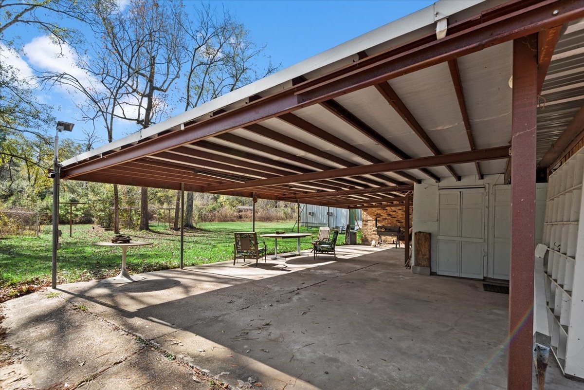 504 Catfish Lane Conroe, TX 77384 - Photo 28 of 48 a view of outdoor space and porch