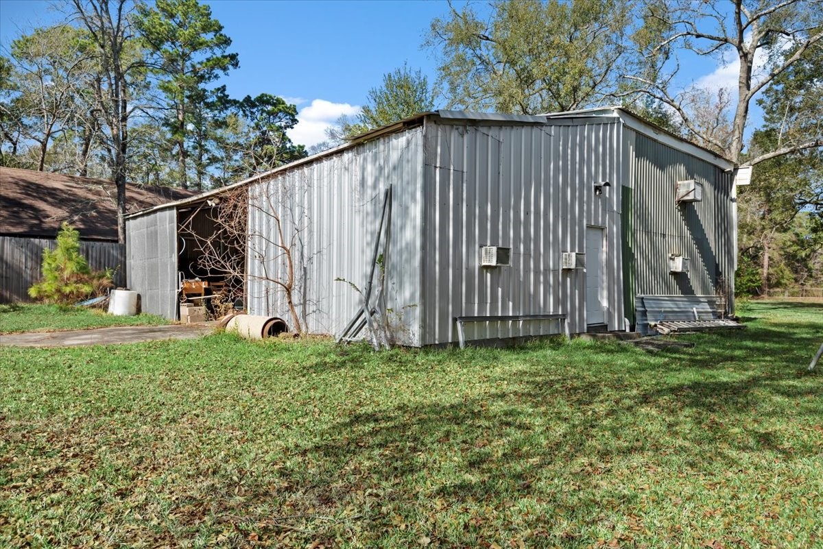 504 Catfish Lane Conroe, TX 77384 - Photo 32 of 48 a view of a house with backyard