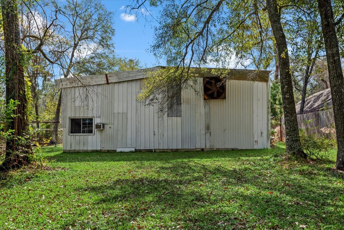 504 Catfish Lane Conroe, TX 77384 - Photo 38 of 48 a view of a backyard