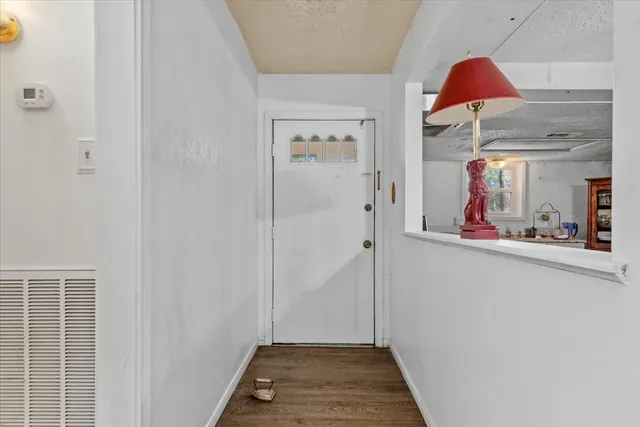 a view of a hallway with paintings on the wall