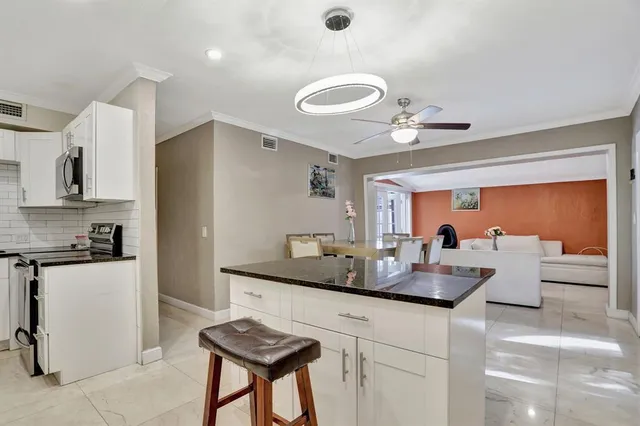 a work room with furniture and rug