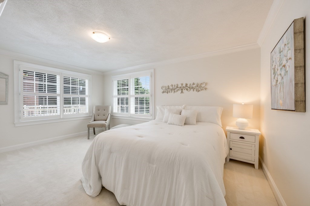758 South Street Needham, MA 02492 - Photo 22 of 30 a bedroom with a bed and a large window