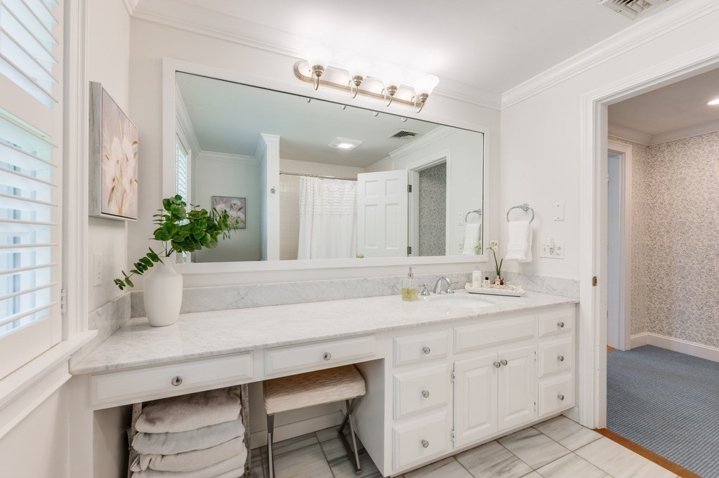 758 South Street Needham, MA 02492 - Photo 25 of 30 a bathroom with a granite countertop sink a mirror and a