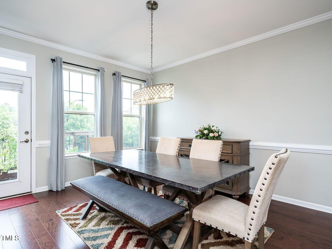 1316 Cornell Place Raleigh, NC 27607 - Photo 12 of 31 a view of a dining room with furniture window and wooden floor
