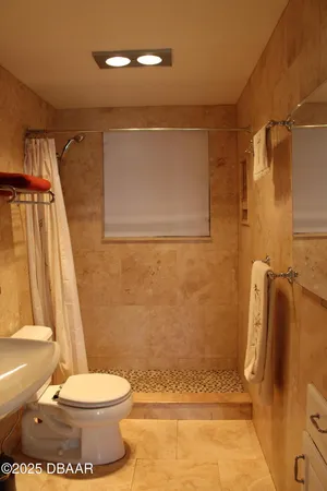 a bedroom with a bed and a mirror
