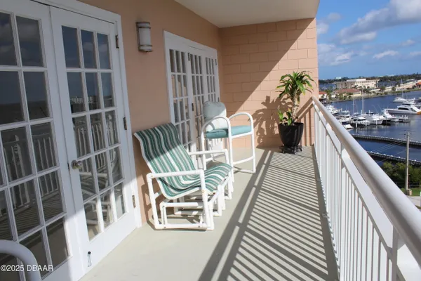 a view of a balcony with potted plants