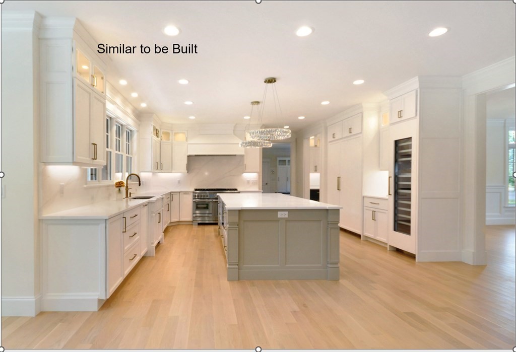 129 Shade Street Lexington, MA 02421 - Photo 4 of 6 a large kitchen with stainless steel appliances kitchen island a large counter top and a sink