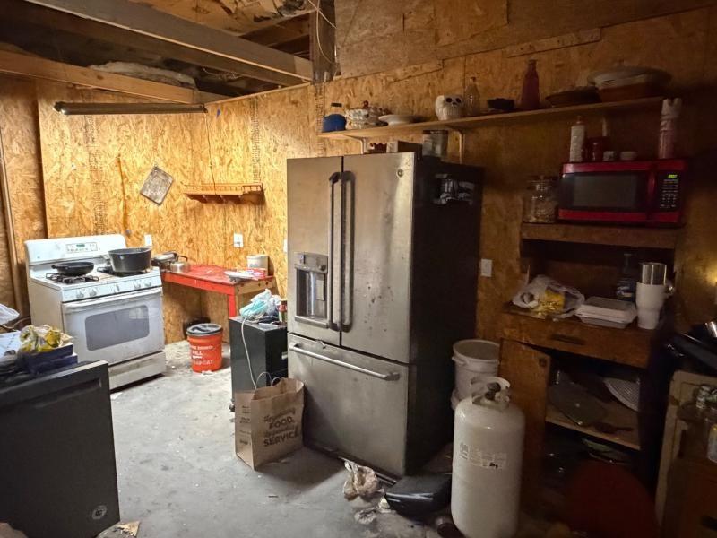 9300 Johns Road Alvarado, TX 76009 - Photo 22 of 40 a kitchen with a refrigerator and a stove