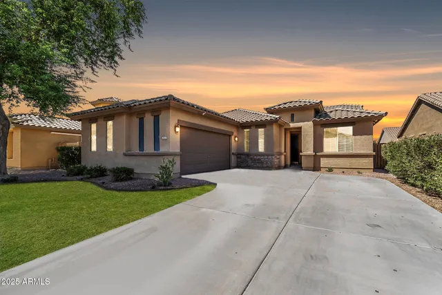 front view of a house with a yard