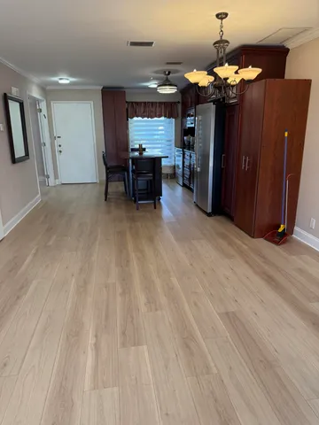 a view of a livingroom with furniture and chandelier