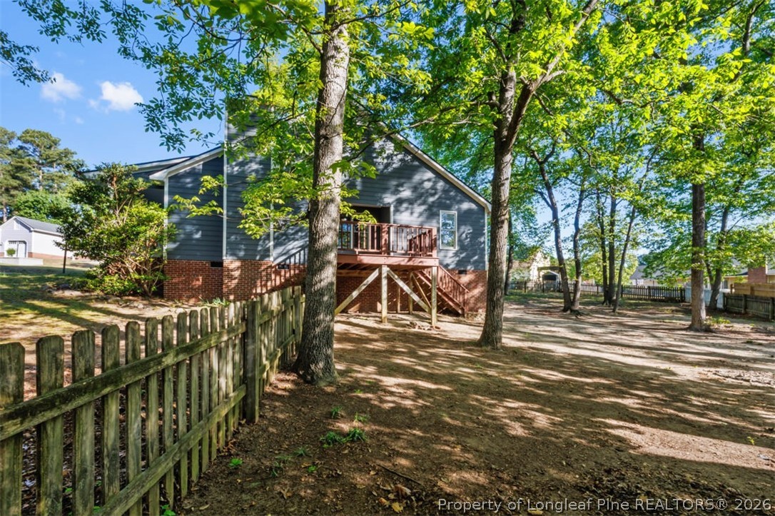 1205 Crossbend Court Fayetteville, NC 28314 - Photo 28 of 37 a view of a house with backyard and trees