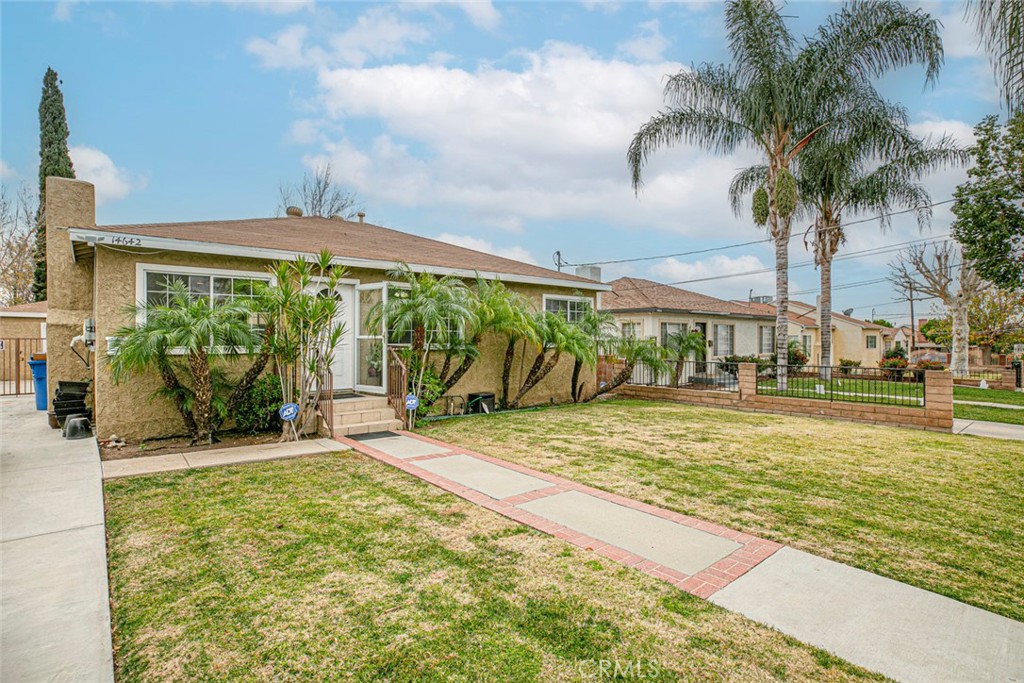 14642 Lakeside Street Sylmar, CA 91342 - Photo 1 of 1 a view of a swimming pool with a patio