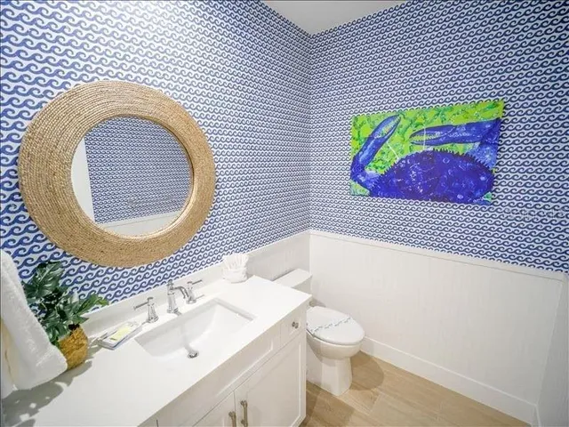 a bathroom with a toilet and a sink