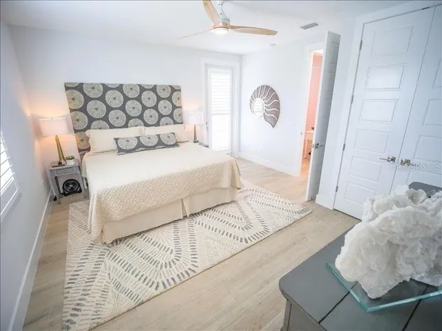 a bedroom with a bed and a table in it