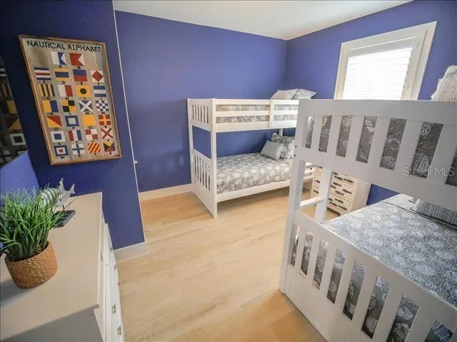 a living room with furniture and flowers