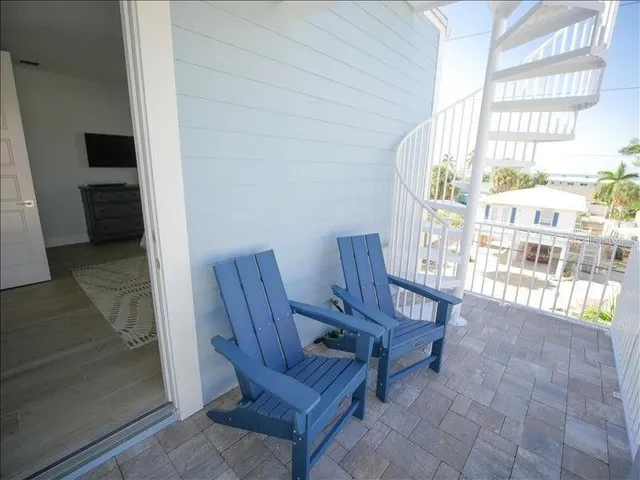 a view of a hallway with seating area
