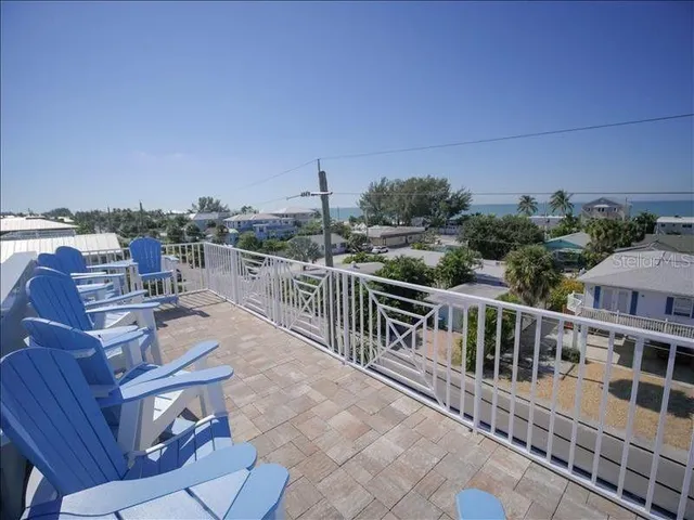 a view of a balcony with chairs