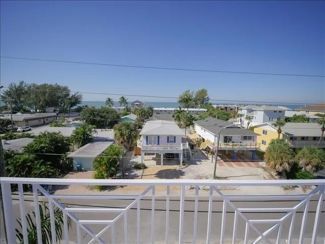 an aerial view of a house with a garden