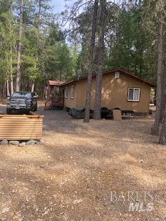 3059 White Horse Crossing Road Potter Valley, CA 95469 - Photo 1 of 6 a backyard of a house with yard and outdoor seating
