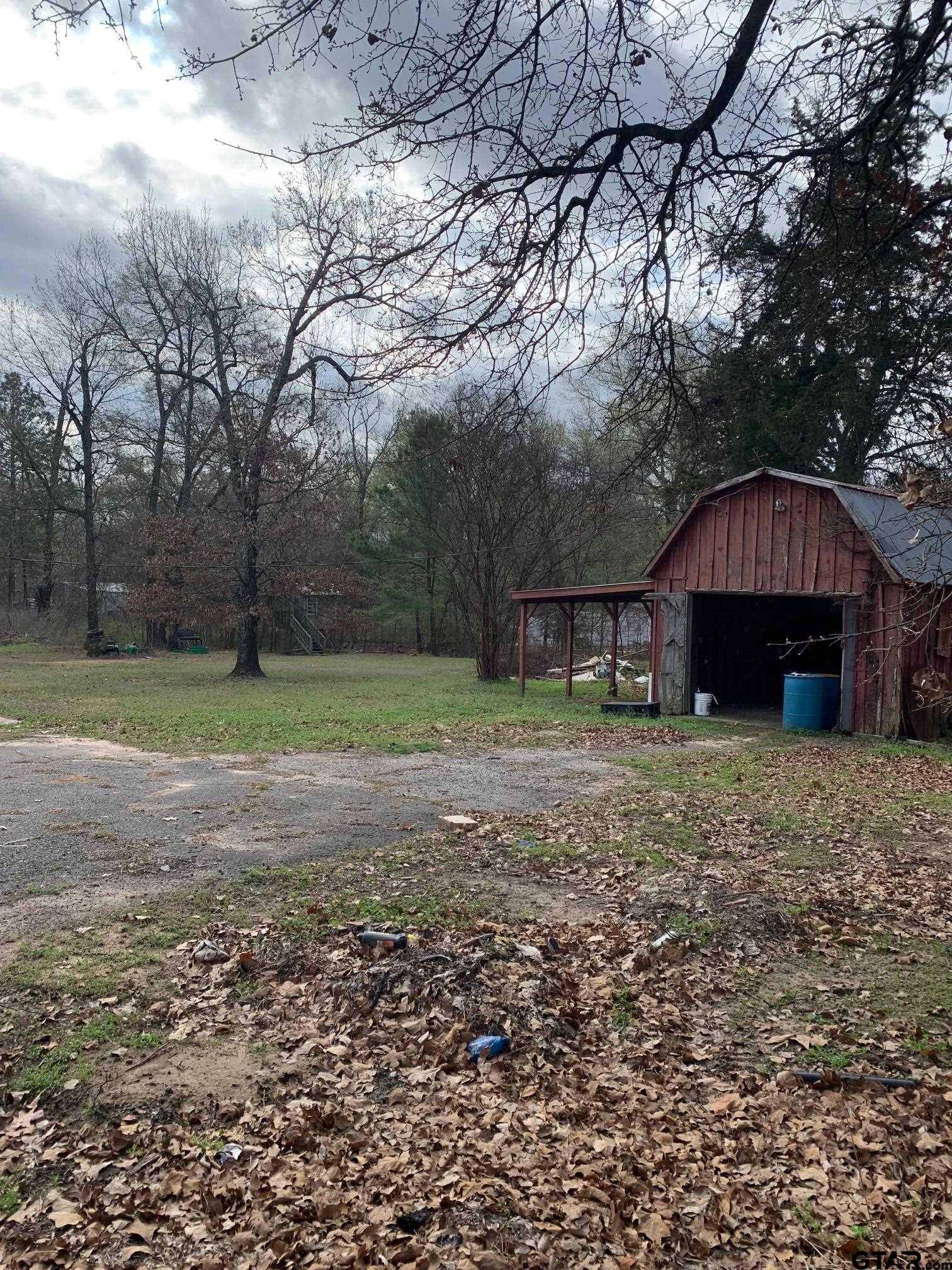 120 Rscr 3340 Emory, TX 75440 - Photo 14 of 21 a front view of a house with a yard