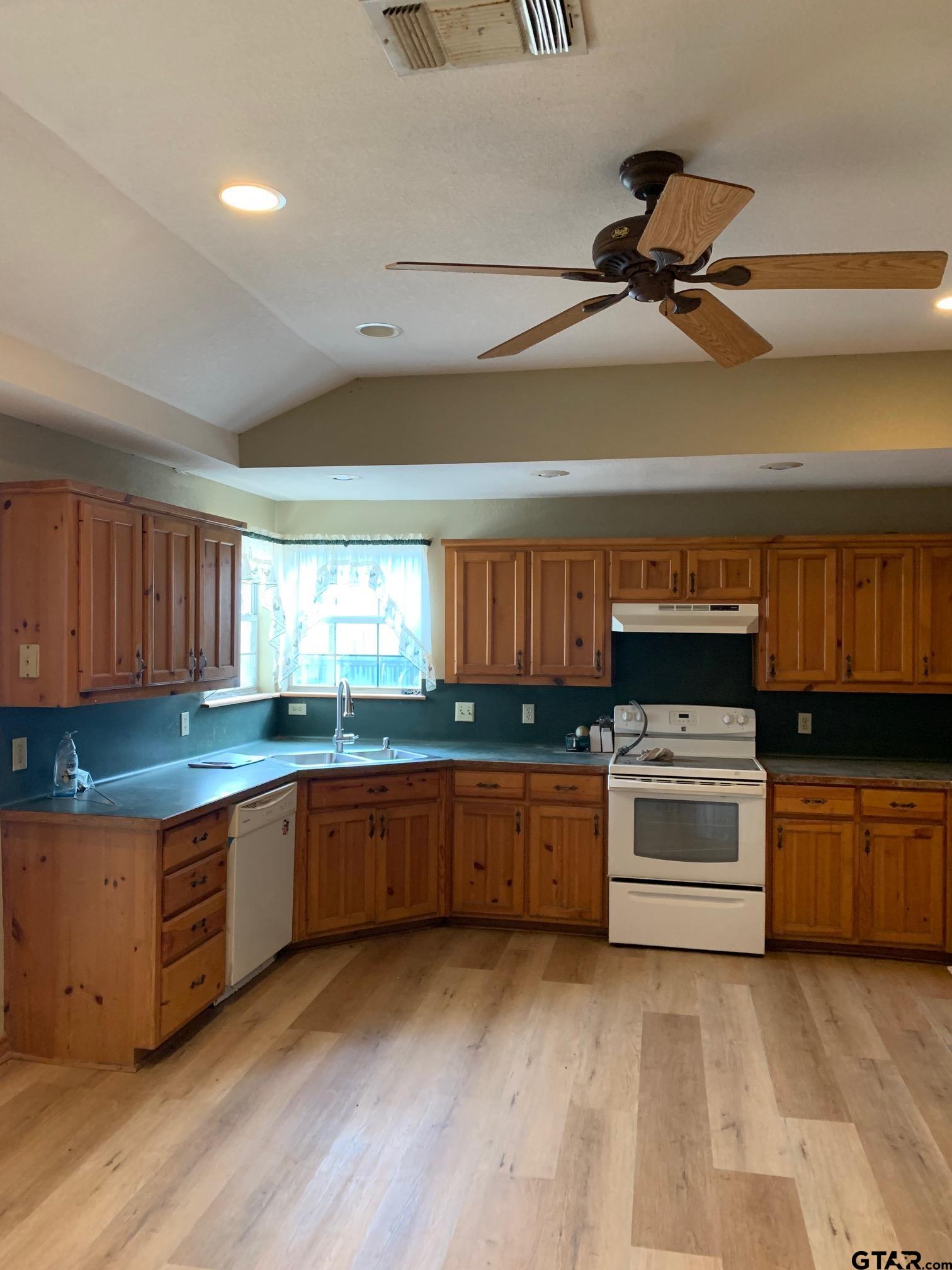 120 Rscr 3340 Emory, TX 75440 - Photo 15 of 21 a kitchen with granite countertop a stove and a sink