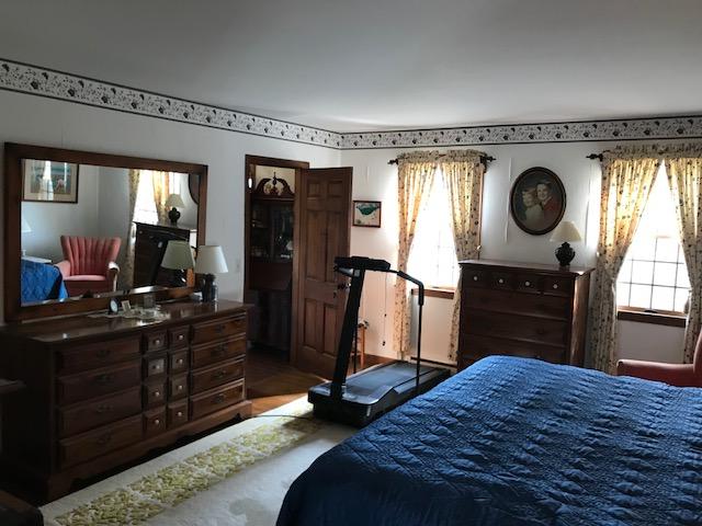 29 Schooner Road Dennis, MA 02638 - Photo 14 of 32 a bedroom with a bed and a television in it