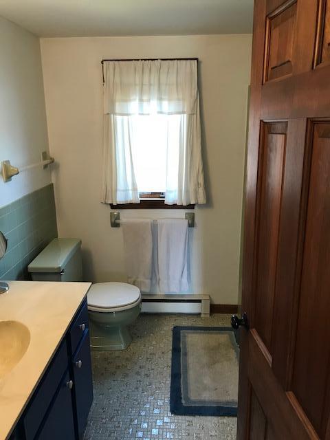 29 Schooner Road Dennis, MA 02638 - Photo 15 of 32 a bathroom with a granite countertop sink mirror vanity and toilet