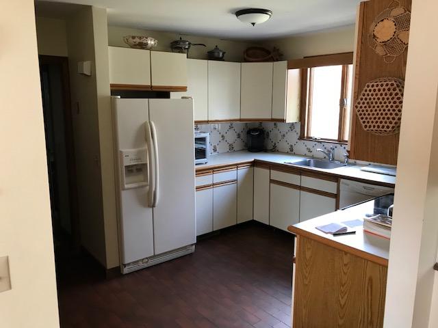 29 Schooner Road Dennis, MA 02638 - Photo 21 of 32 a kitchen with a refrigerator sink and cabinets