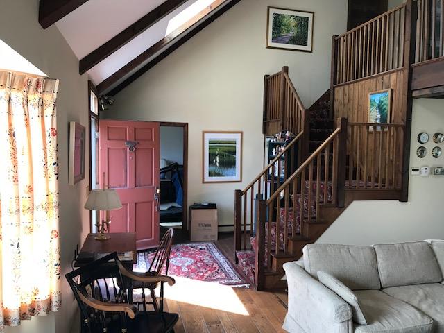 29 Schooner Road Dennis, MA 02638 - Photo 23 of 32 a living room with furniture or stairs and a window
