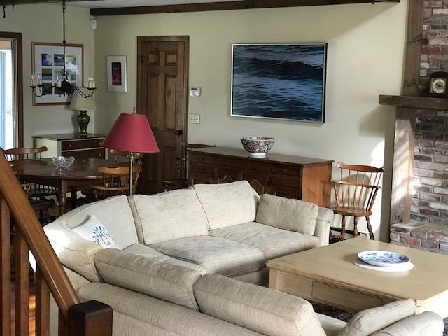 29 Schooner Road Dennis, MA 02638 - Photo 25 of 32 a living room with furniture and a lamp