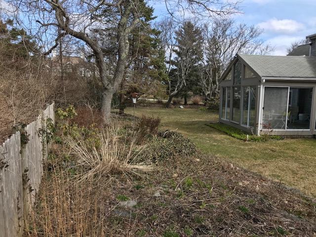 29 Schooner Road Dennis, MA 02638 - Photo 28 of 32 a view of a house with backyard