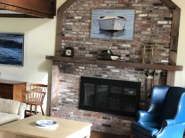 29 Schooner Road Dennis, MA 02638 - Photo 30 of 32 a living room with furniture and a fireplace