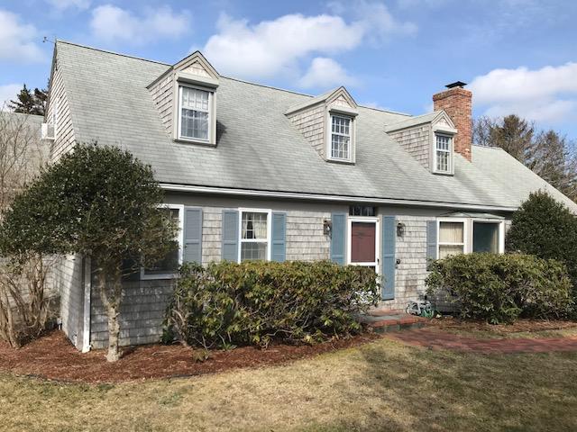 29 Schooner Road Dennis, MA 02638 - Photo 4 of 32 a front view of a house with a yard