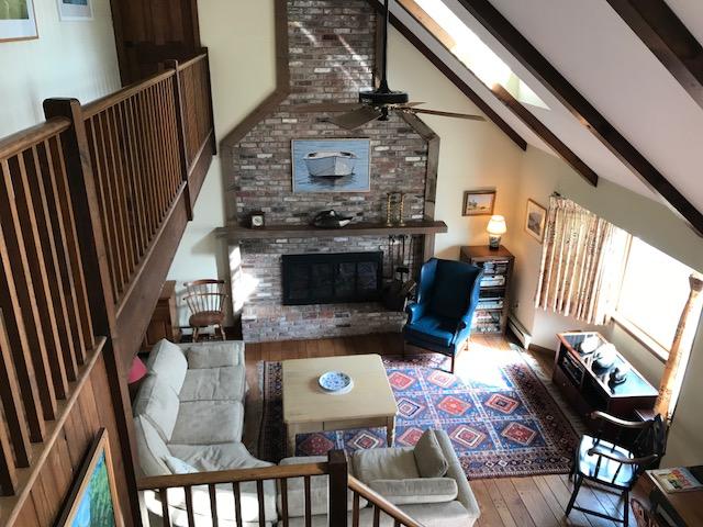 29 Schooner Road Dennis, MA 02638 - Photo 5 of 32 a living room with furniture and a fireplace