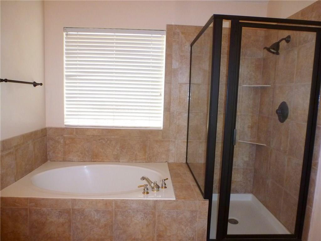 9911 Max Lane Frisco, TX 75035 - Photo 13 of 16 a bath tub sitting next to a shower
