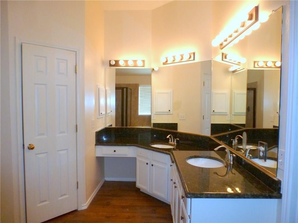 9911 Max Lane Frisco, TX 75035 - Photo 14 of 16 a bathroom with a granite countertop sink and a mirror