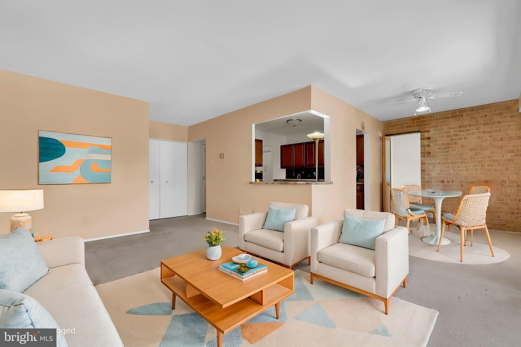 19309 Club House Road, Unit 19309 Gaithersburg, MD 20886 - Photo 12 of 24 a living room with furniture and a flat screen tv