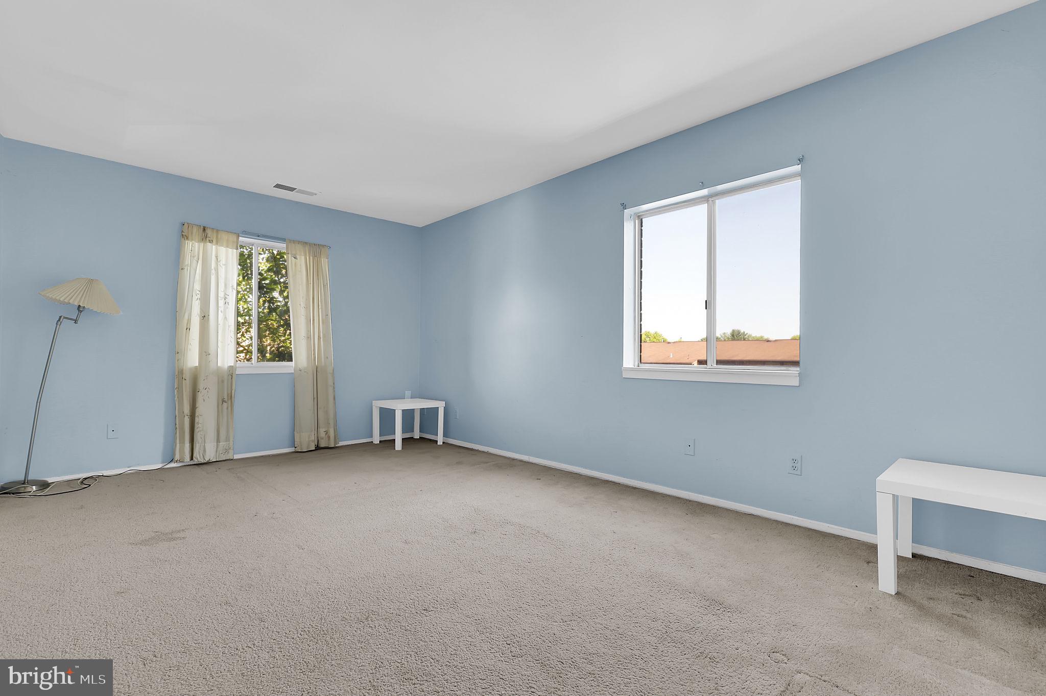 19309 Club House Road, Unit 19309 Gaithersburg, MD 20886 - Photo 16 of 24 an empty room with windows