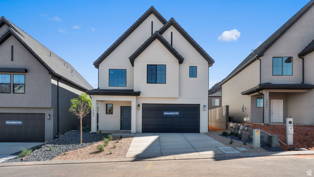 1511 Fins Road, Unit 4117 Washington, UT 84780 - Photo 1 of 1 Modern farmhouse featuring stucco siding, concrete driveway, and a garage