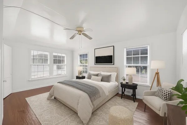 a bedroom with a bed and a couch