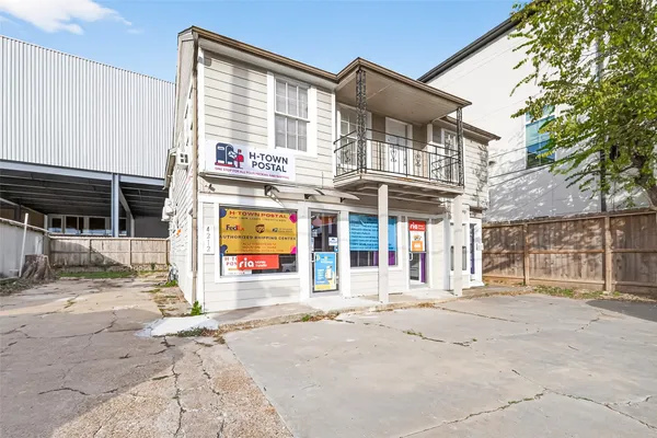 a front view of a building with retail shops