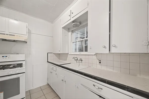 a kitchen with appliances cabinets and a sink