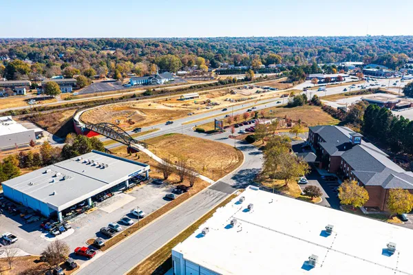 an aerial view of residential houses with outdoor space