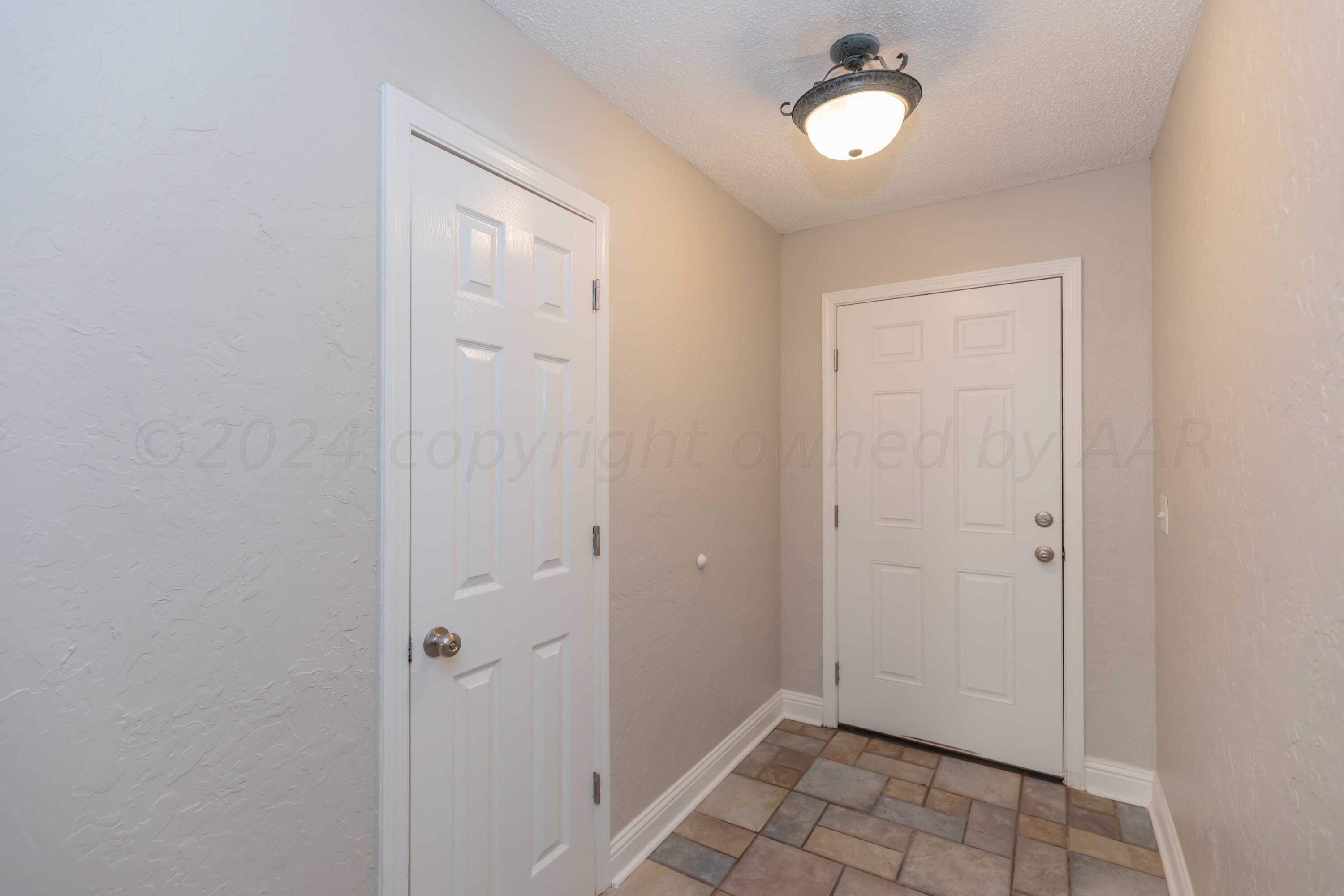 8312 Lamount Drive Amarillo, TX 79110 - Photo 3 of 53 a view of an empty room with closet and a window