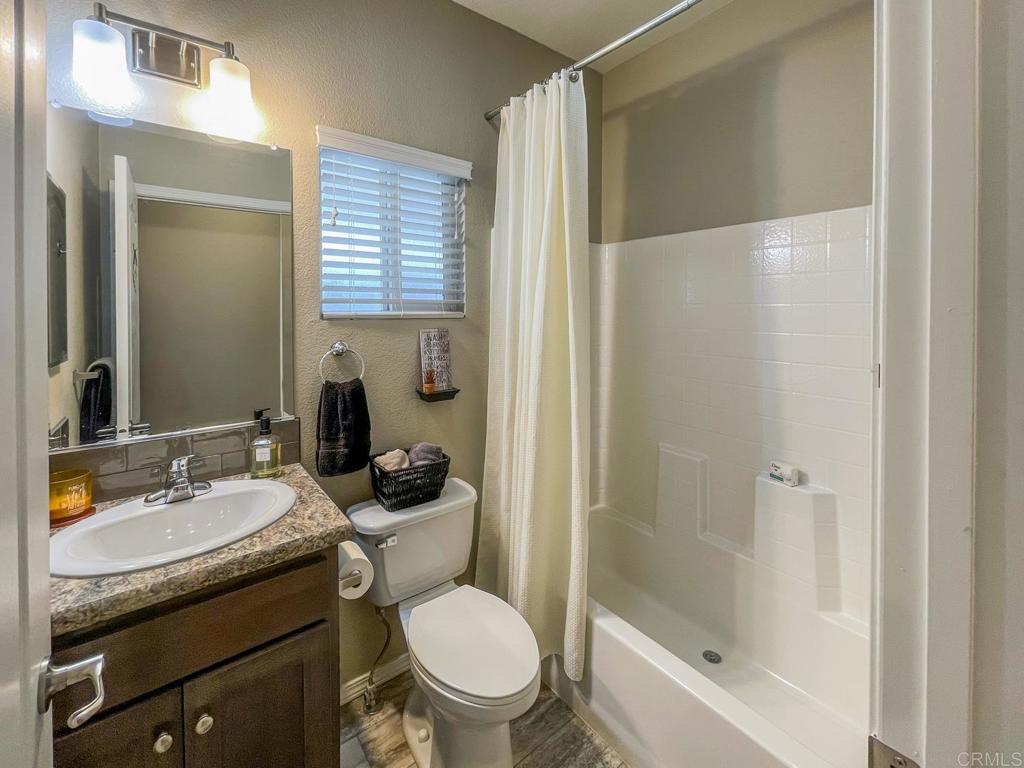 8545 Mission Gorge Road, Unit SPC 211 Santee, CA 92071 - Photo 14 of 33 a bathroom with a granite countertop sink toilet and shower