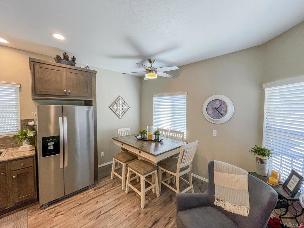 8545 Mission Gorge Road, Unit SPC 211 Santee, CA 92071 - Photo 20 of 33 a view of a dining room with furniture and a chandelier