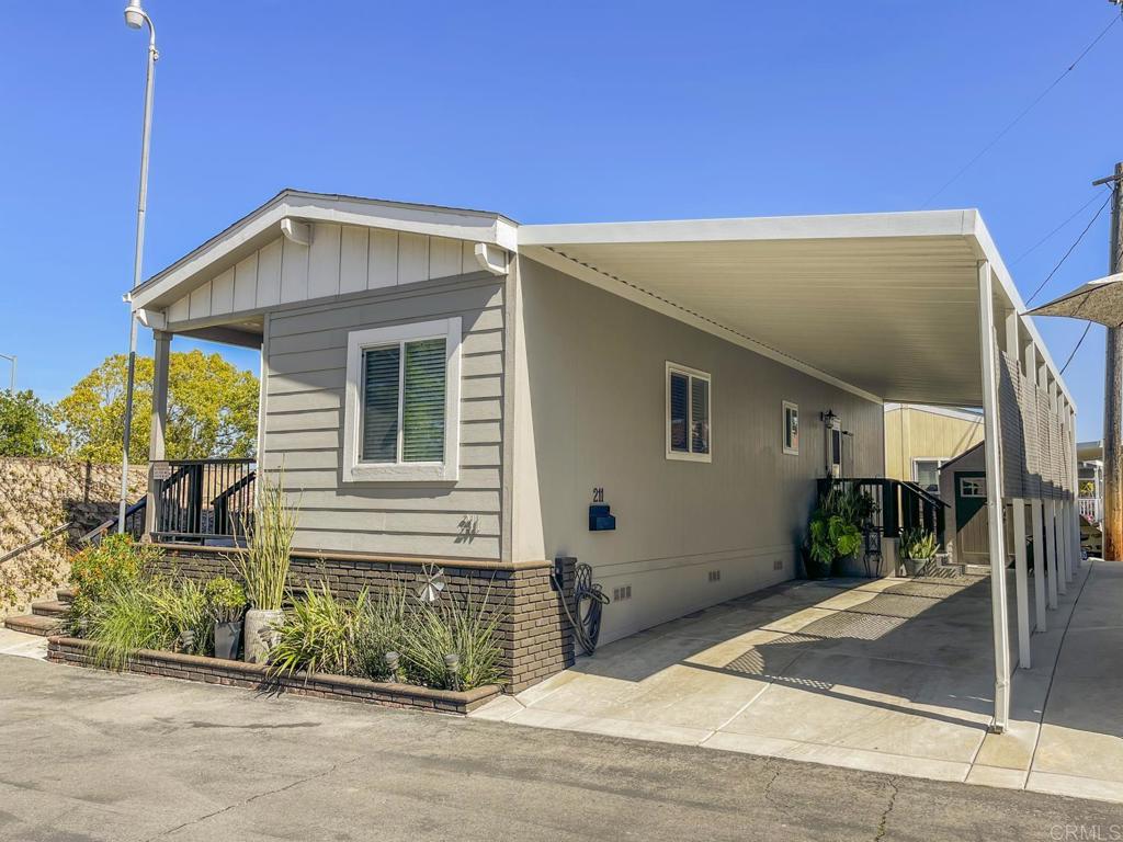 8545 Mission Gorge Road, Unit SPC 211 Santee, CA 92071 - Photo 2 of 33 a view of a house with a garage